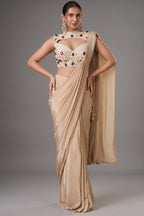 Champagne Beige Satin Crepe Pre-Draped Saree featuring Keyhole Cutout Choli Heavily Encrusted with Jewels