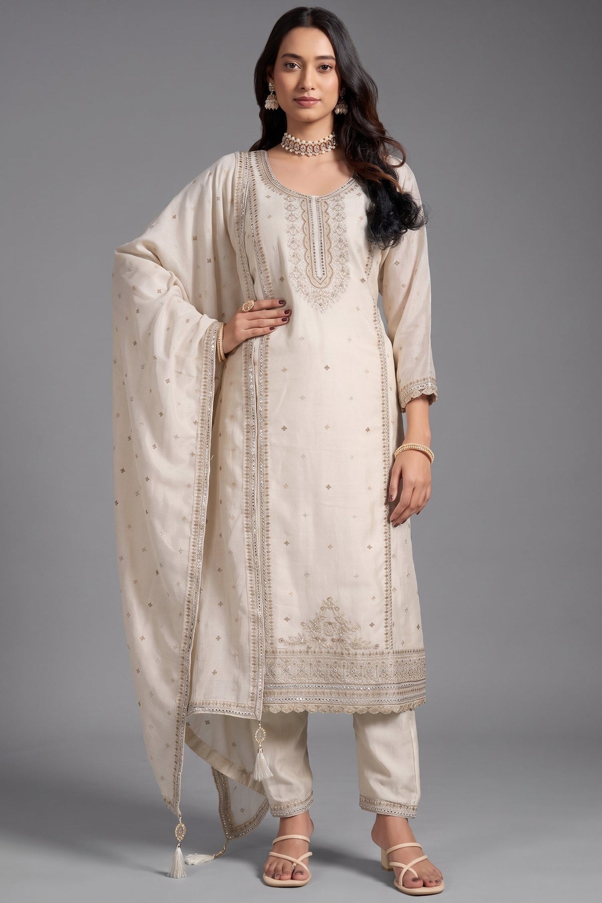 Opulent Creamy Ivory Art Silk Straight Cut Salwar Suit with Applique and Embroidery Work